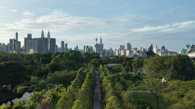 aerial view of kuala lumpur in the background with beautiful morning lark park scenery people jog