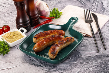 Delicous natural roasted sausages in the plate