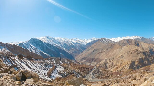 4K shot of snow covered peaks of the Himalayan mountain range as seen from Nako village towards Spiti valley during the winter season in Himachal Pradesh, India. Beautiful Himalayas during winter.