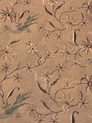 Floral vintage carpet with flowers, branch, bird, and twigs. Classic vintage carpet rug with floral ornaments and swirls pattern. Seamless background texture.