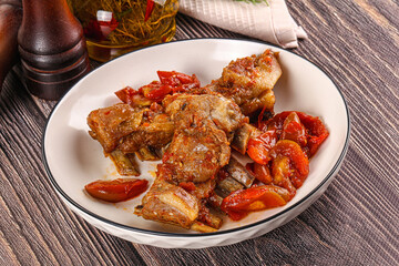 Baked lamb ribs with vegetables