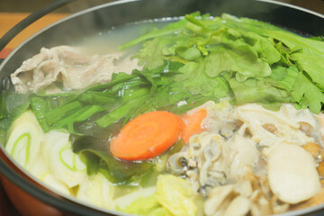 Nabe dishes with many ingredients such as fish, vegetables, and meat, popular in winter in Japan.