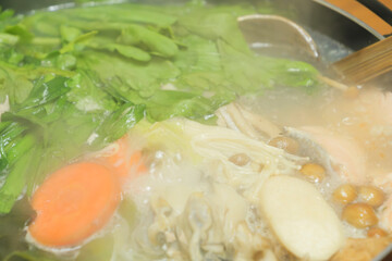 Nabe dishes with many ingredients such as fish, vegetables, and meat, popular in winter in Japan.