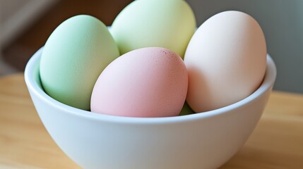 Colorful Easter Eggs in a White Bowl on a Wooden Surface