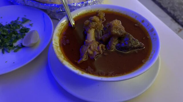 Mutton nihari served with tandoori roti in a restaurant in Kolkata