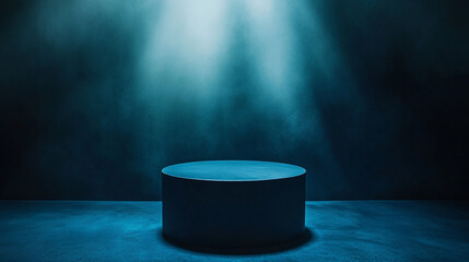 Empty circular podium illuminated by soft blue light in a dark setting. 