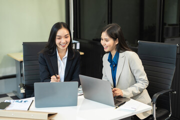 Fototapeta premium Business team meeting present.professional investor working with new startup project. Finance managers task.Digital tablet laptop computer design smart phone in morning light.