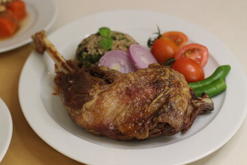 Cooked turkey, rice, nuts and oak plate prepared for Christmas 2024
