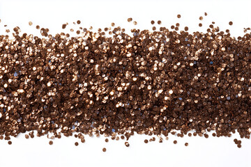 There is a pile of shimmering brown glitter placed on a white background