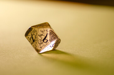 close-up view of a transparent die for board games and role-playing games