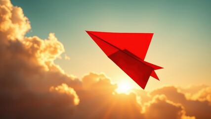 A crimson paper airplane soars gracefully through a vibrant sunset sky, its journey a symbol of dreams taking flight and aspirations reaching new heights.