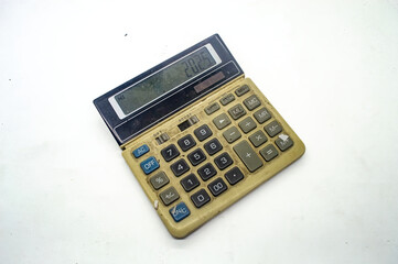 Old, vintage calculator with a worn out keypad and display showing 2025. Ideal for retro technology...