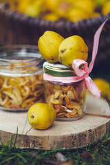 Freshly picked quinces and dried fruit slices in a rustic outdoor setting