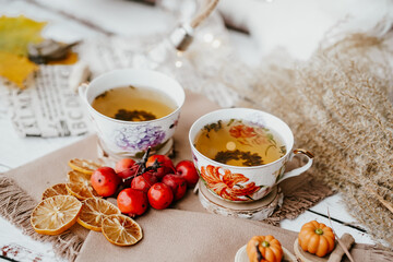 Cozy autumn vibes with herbal tea, dried citrus slices, and seasonal decor – a perfect setting...