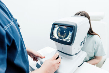 Patient checkup ophthalmologist, medical equipment checking vision, close up eye