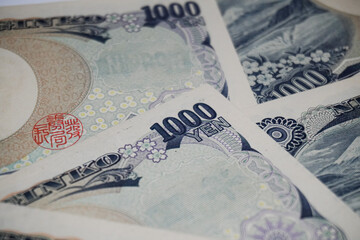 A collection of close-up photos of the Japanese 1,000 Yen banknote
