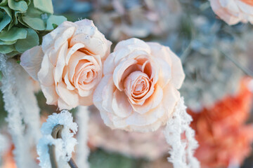 Wedding or engagement decoration, with rings in flower petals and wedding gifts on a colorful floral decoration background