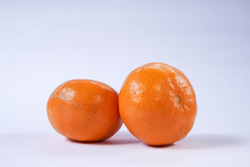 Tangerine or Mandarin orange on a white background is suitable for use in poster designs, or as an...
