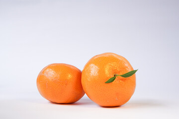Tangerine or Mandarin orange on a white background is suitable for use in poster designs, or as an illustration for articles about fruits.