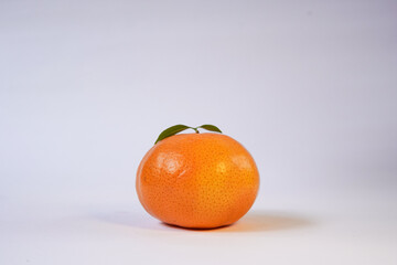 Tangerine or Mandarin orange on a white background is suitable for use in poster designs, or as an illustration for articles about fruits.