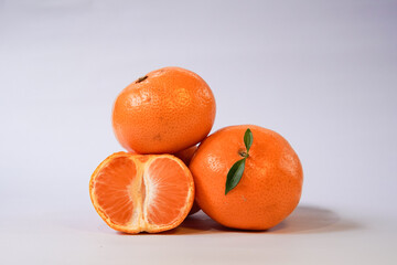 Tangerine or Mandarin orange on a white background is suitable for use in poster designs, or as an illustration for articles about fruits.