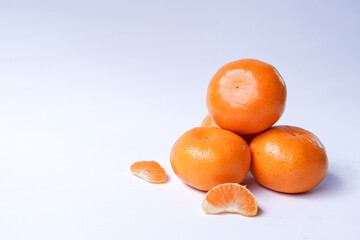 Tangerine or Mandarin orange on a white background is suitable for use in poster designs, or as an illustration for articles about fruits.
