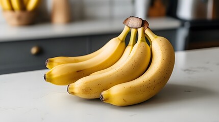 Fresh bananas arranged on kitchen counter indoor food photography bright natural light close-up view healthy snack ideas