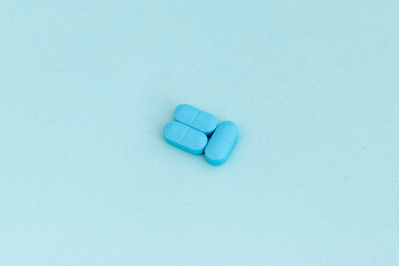 Pills on blue background with copy space