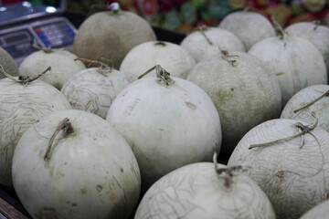 Whole melons sold in fruit shops are suitable for design purposes, as illustrations for articles about fruits and others.