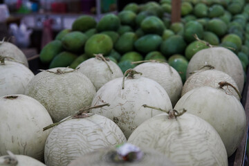 Whole melons sold in fruit shops are suitable for design purposes, as illustrations for articles about fruits and others.