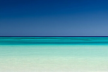 Serene seascape showcasing a gradient of blues and greens meeting a clear horizon.
