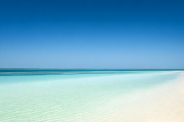 Obraz premium Serene beach scene with clear turquoise water and a cloudless sky.