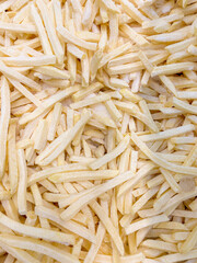 close up view of frozen french fries background