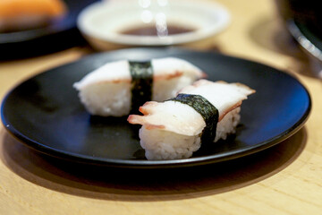 Tako nigiri sushi or octopus sushi on a plate