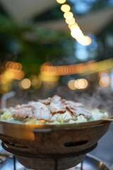 Thai barbecue grill pork on hot pan. Barbecue buffet pig pan and vegetables in soup. Thai food.
