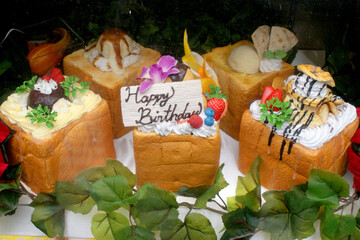 Japanese dessert styled like a cake. It features fruit, whipped cream, and a sweet 