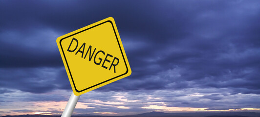 Hurricane Idalia warning sign against a powerful stormy background with copy space. Dirty and angled sign with cyclonic winds add to the drama.hurricane season sign on cloudy background