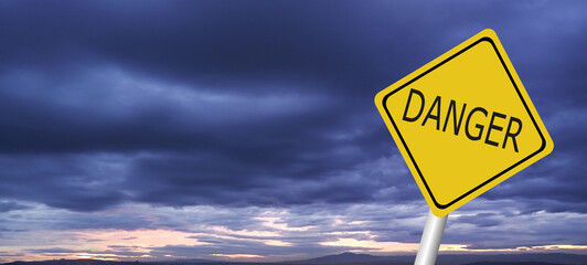 Hurricane Idalia warning sign against a powerful stormy background with copy space. Dirty and angled sign with cyclonic winds add to the drama.hurricane season sign on cloudy background