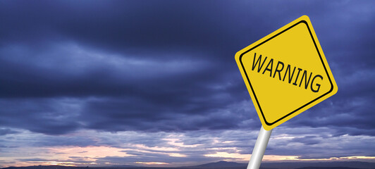 Hurricane Idalia warning sign against a powerful stormy background with copy space. Dirty and angled sign with cyclonic winds add to the drama.hurricane season sign on cloudy background