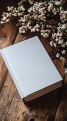 Fototapeta premium Blank notebook resting on rustic wooden table in natural light