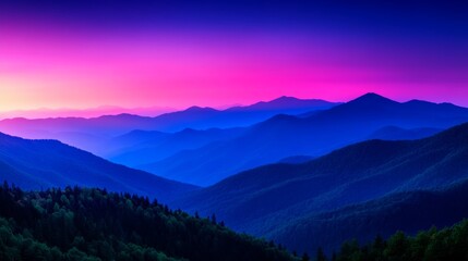 Fototapeta premium Dramatic mountain range vista at sunset with layers of peaks and vibrant sky