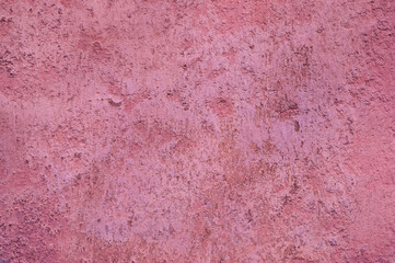 gray background, photo shows texture of pink wall close-up