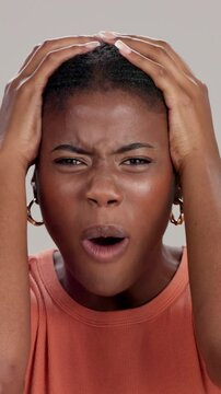 Angry, face and frustrated black woman shouting on studio background for stress, mental health and panic attack. Bipolar rage, person and portrait with screaming for disaster, trauma and depression