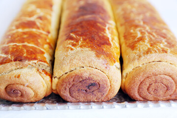 Composition of homemade walnut and poppy seed rolls aka beigli in Hungary. Traditional hungarian christmas or easter cake bejgli at christmastime. Freshly baked sweet filled strudel cakes