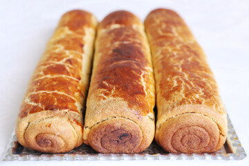Composition of homemade walnut and poppy seed rolls aka beigli in Hungary. Traditional hungarian christmas or easter cake bejgli at christmastime. Freshly baked sweet filled strudel cakes