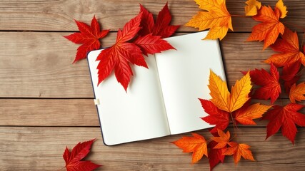 Obraz premium Autumnal Open Notebook with Colorful Leaves on Wooden Surface