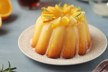 A sweet citrus cake served with oranges and lemons