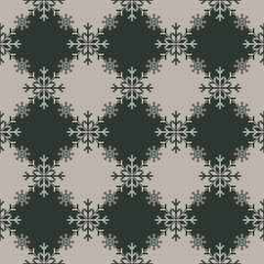 2 tone Christmas snowflake texture on geometric rhombus background. Elegant seamless vector pattern for wrapping paper, textile and paper prints, greeting cards and gift boxes.