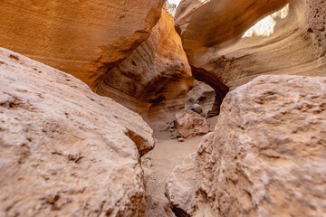 A narrow passage with a lot of rocks and dirt