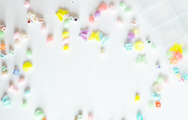 Beads set for children hobby. Kids beads to create jewelry with copy space.